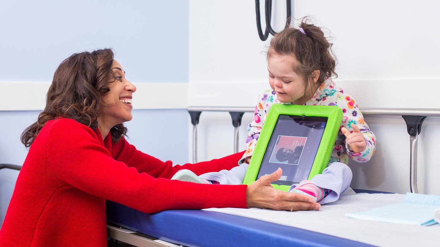 Doctor of Nursing practice interacting with a child