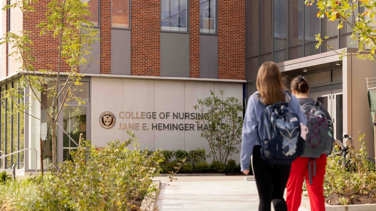 students walking in front of Jane E. Heminger Hall